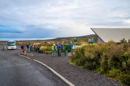 Mount Tongariro - March 26,2016 : Entry point off Mangatepopo Road to the Mount Tongariro. People can seen waiting their friend and preparing to start their adventure.のeditorial素材