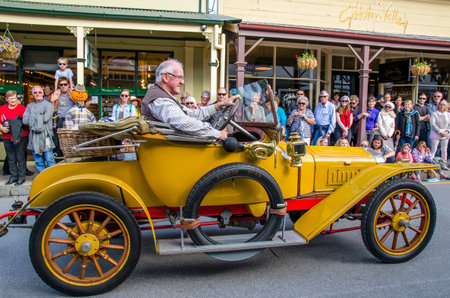 Arrowtown, New Zealand - April 23,2016 : There is parade event during the Arrowtown Autumn Festival on Buckingham Street, people can seen watching and enjoying the parade.のeditorial素材