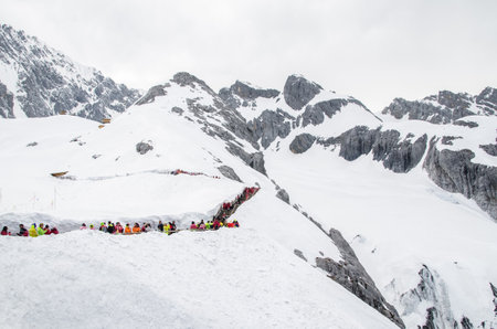 Yunnan,China - April 12,2017 : Landscape of Yulong Snow Mountain, it also known as Jade Dragon Snow Mountain which is located in Yunnan,China. People can seen exploring around it.のeditorial素材