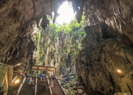 Kuala Lumpur,Malaysia - June 10, 2017 : People can seen exploring and praying in the Hindu Temple in Batu Caves Kuala Lumpur Malaysia.のeditorial素材