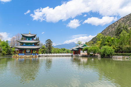 Lijiang,China - April 11,2017 : Landscape view of the Black Dragon Pool, it is a famous pond in the scenic Jade Spring Park located at the foot of Elephant Hill,Lijiang China.のeditorial素材