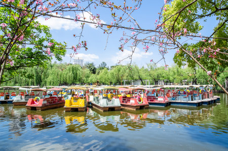 Kunming,China - April 8,2017 : Pedalo boats parking in Green Lake Park ,it also known as Cui Hu Park is one of the most beautiful parks in Kunming city.のeditorial素材