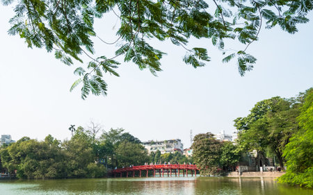 Hanoi,Vietnam - November 2,2017 : Red Huc bridge in Hoan Kiem Lake,Hanoi. Hoan Kiem Lake meaning "Lake of the Returned Sword". People can seen exploring around it.のeditorial素材