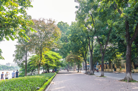 Hanoi,Vietnam - November 2,2017 : Scenic view of the lakeside of Hoan Kiem Lake, people can seen relaxing and exploring around it.のeditorial素材