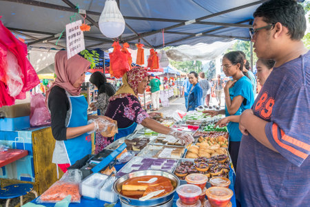 Kuala Lumpur,Malaysia - May 27, 2018 : People can seen buying foods and snacks at the stall in Ramadan Bazaar.It is established for muslim to break fast during the holy month of Ramadan.のeditorial素材