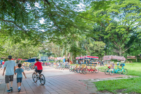 Kuala Lumpur, Malaysia - May 29,2018 : Bike rental for public in Titiwangsa Lake Gardens, it is a recreational park with a large lake as its main attraction.  People can seen exploring around it.のeditorial素材