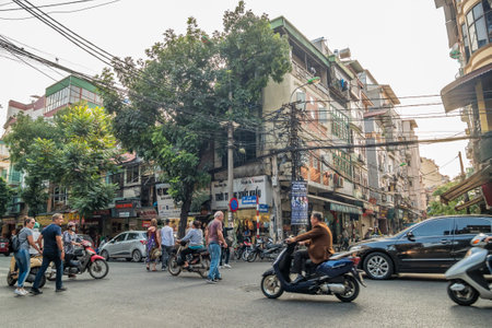 Hanoi,Vietnam - November 2 ,2017 : View of busy traffic with motorbikes and vehicles in Hanoi Old Quarter, capital of Vietnam.のeditorial素材