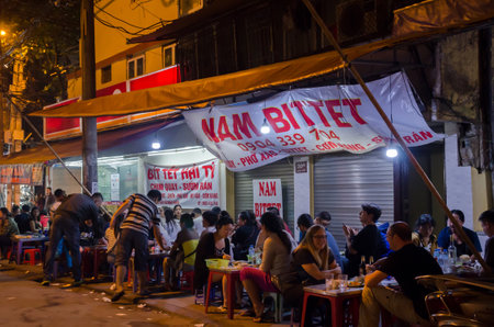 Hanoi,Vietname - November 5,2017 - People can seen enjoying their food at the food stalls in Hanoi,Vietnam.のeditorial素材