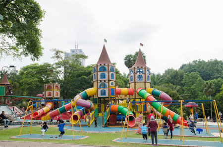Kuala Lumpur,Malaysia â August 31,2018 : Lake Gardens also known as Kuala Lumpur Perdana Botanical Gardens,children can seen playing the playground which is located at the gardens.のeditorial素材