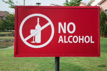 Close-up of the no alcohol sign in the park near residential area.の写真素材