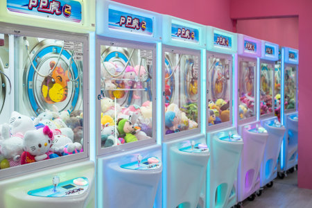 Kuala Lumpur,Malaysia - September 7,2019 : Colorful arcade game toy claw crane machine where people can win toys and other prizes which is located in the shopping mall,Kuala Lumpur.のeditorial素材