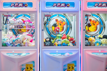 Kuala Lumpur,Malaysia - September 7,2019 : Colorful arcade game toy claw crane machine where people can win toys and other prizes which is located in the shopping mall,Kuala Lumpur.のeditorial素材