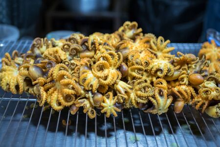 Close-up view of the fried octopus as snack street food in Bangkok,Thailand.