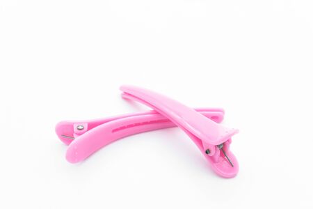 Pink hair clips isolated on the white background.の写真素材
