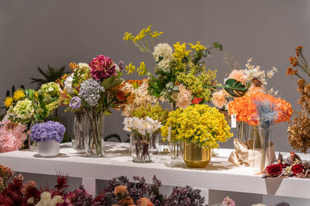 Beautiful showcase of flower shop with large assortment of artificial flowers.の写真素材