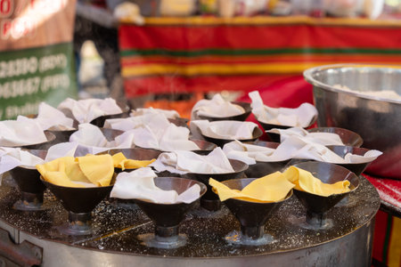 Putu Piring selling during Ramadan bazaar, it is a round-shaped steamed rice flour kueh or sweet...