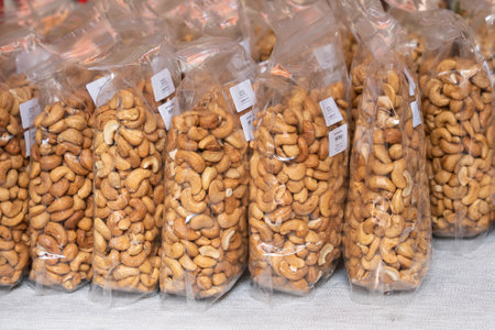 Close-up view of packed cashew nuts selling in the marketの写真素材