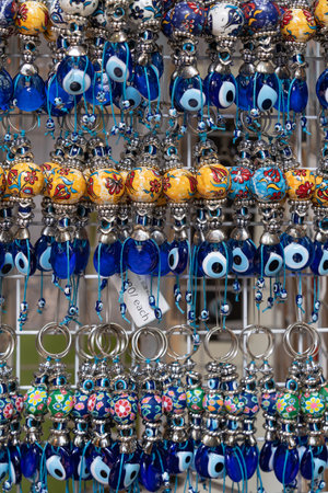 The glass evil eye keychains for sale in the souvenir shop.の写真素材
