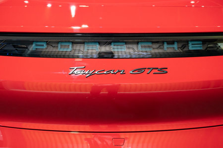 Serdang, Malaysia - May 24,2024 : Close-up view of the Porsche Taycan GTS's logo.