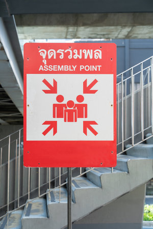 An assembly point sign at the exterior of a buildingの写真素材