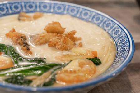 Milky Sliced Fish Meehon. It's a variation of fish soup, typically made with sliced fish, meehoon...