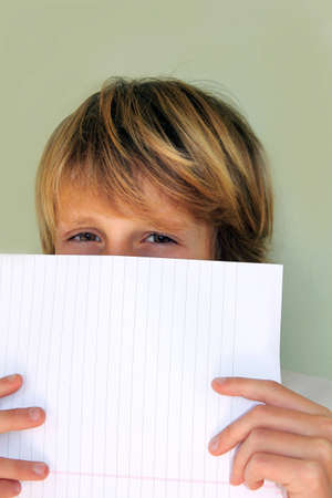 Child and tasks at school, looking の写真素材