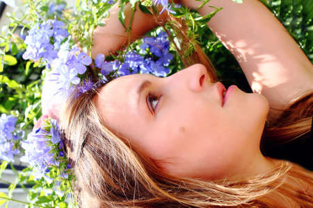 Woman lying down facing the skyの写真素材