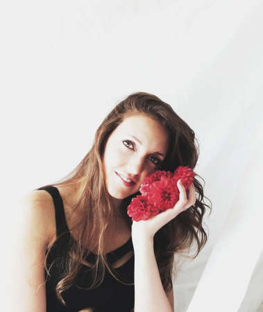 beautiful happy woman with flowersの写真素材