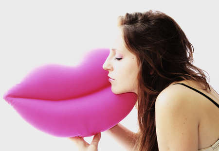 happy woman sleeping on pink mouthの写真素材