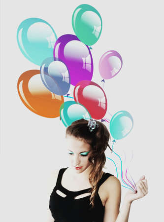 Happy teenager woman with balloons makeupの写真素材