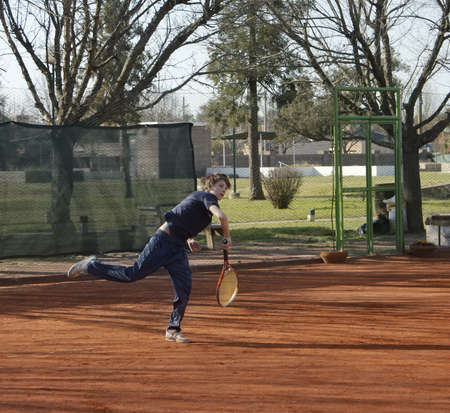child playing a game of tennis の写真素材