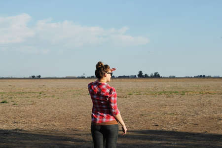 young woman looking to the horizon の写真素材