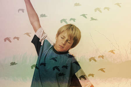 child who dreams of flying like birdsの写真素材