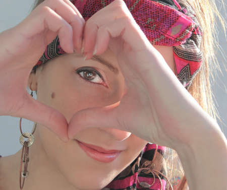 Woman doing a heartの写真素材