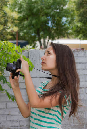 Teen taking pictures of the retro cameraの写真素材
