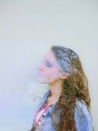 double exposure in woman among the treesの写真素材