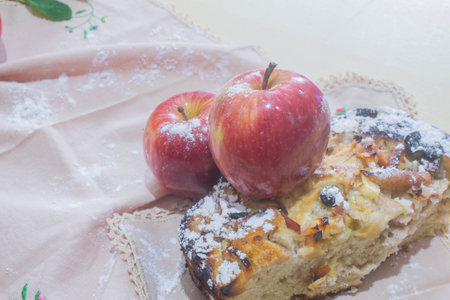 Apple cake with icing sugar on the table. Selective focus.の写真素材