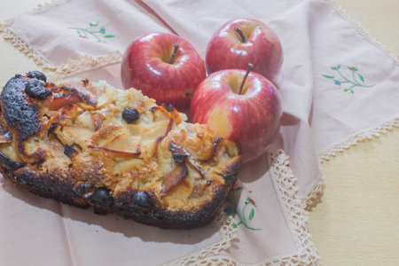Apple pie with fresh apples on a wooden table. Selective focus.の写真素材