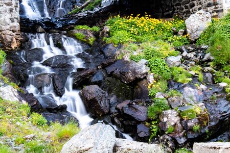Beautiful waterfall in the mountainsの写真素材