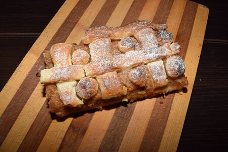 Traditional apple pie on a wooden boardの写真素材