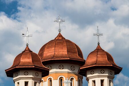 Church copper roof towers with christian crosses aboveの写真素材