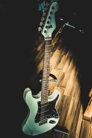 View of a black and white vintage guitar