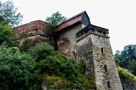 Tree covered old stronghold watchtower ruin in the mountainsの写真素材