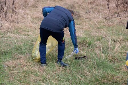 Man gathering litter from natureの写真素材