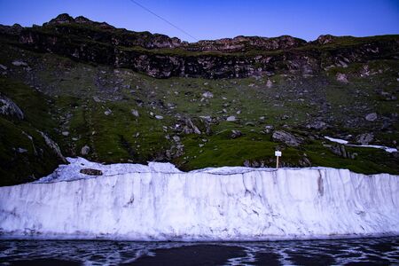 Ice wall at the bottom of the mountainsの写真素材