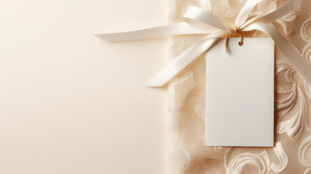 white blank tag with a rope for mockup on cream color backgroundの素材