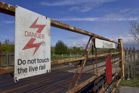 Rusted level crossing by railway lineの写真素材