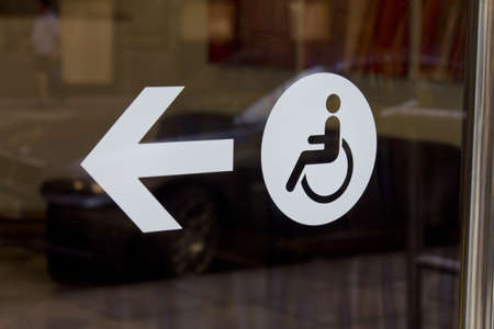 A sign marking a disabled entranceの写真素材