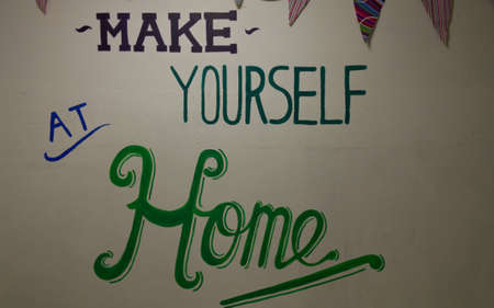 A painted sign on a wall saying の写真素材