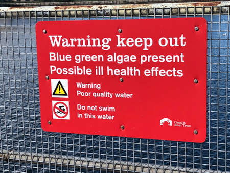 A sign warning people not to swim in the water, Birkenhead Docks, Wirralの素材
